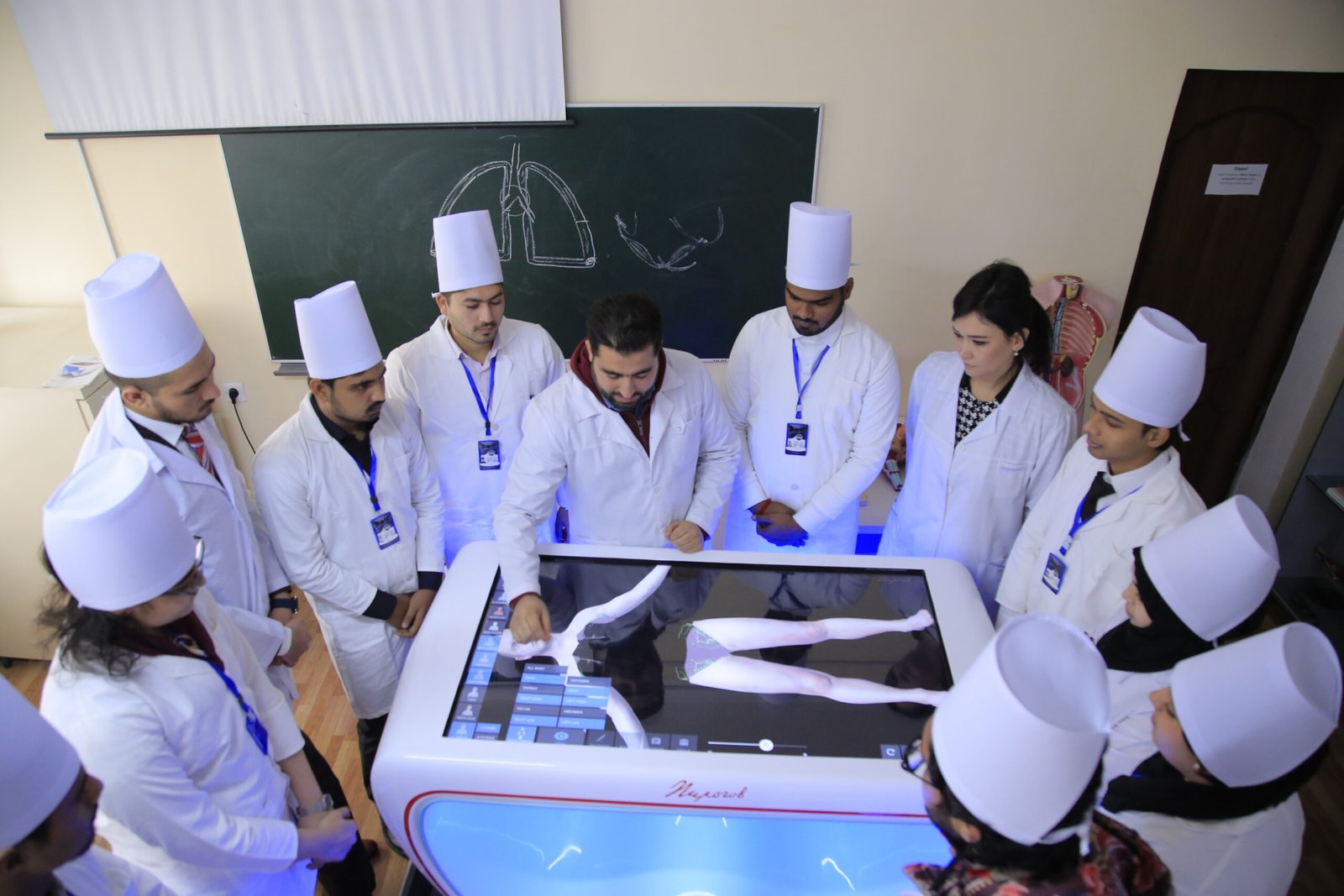 Medical students learning with an interactive anatomy table